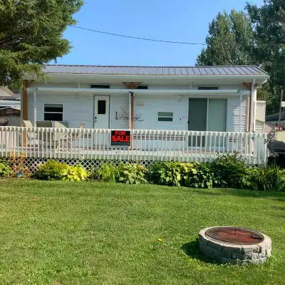 I have a 2007 32 feet park model trailer with brand new metal roof that covers trailer and pull outs...