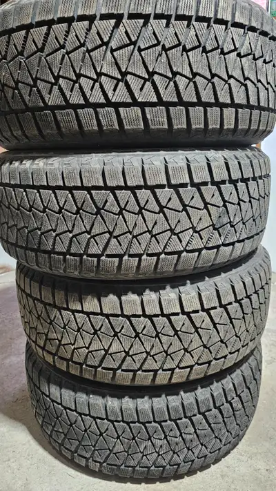 selling four 20 inch Bridgestone winter tires for $800 two tires are 95% of tread remaining. the oth...