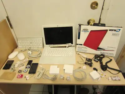 MacBook 13”, wireless keyboard, adapters, cables, I-Pods, Iphone, View more