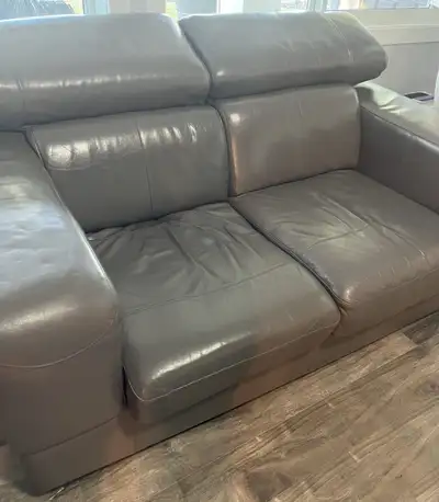 Good Quality Gray Leather couch. Head rest raises and lowers. Non smoking - non pets home. 5 ft. 6 i...