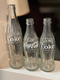 3 Coca Cola bottles