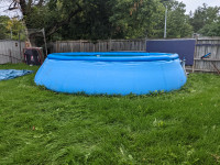 Free 18 ft pool. Top ring slowly leaks air. Good condition.