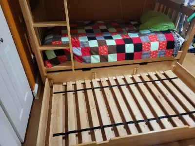 Purchased in about 2014, this twin-size trundle bed doubles as storage, fitting under Maxtrix bunk-b...