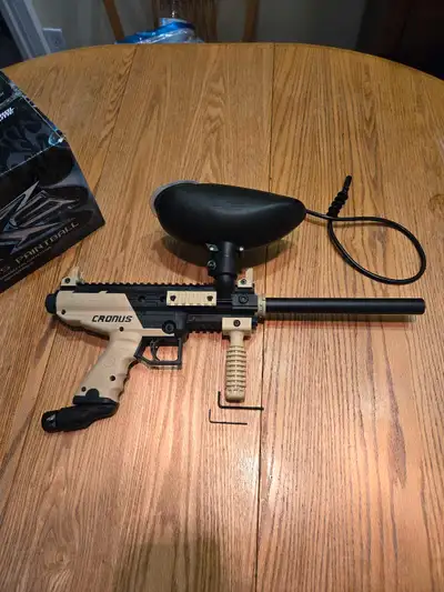 68. Cal Tippmann Cronus paintball Marker, and an unopened box of 2000, 68. Cal paintballs Only used...