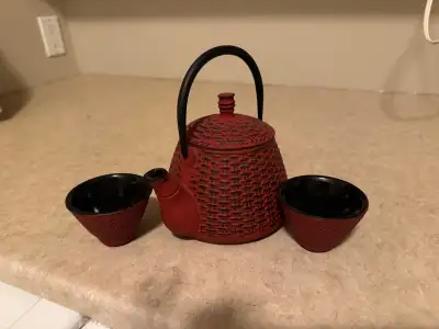 Cast iron  with  interior porcelain teapot and two cups, View more