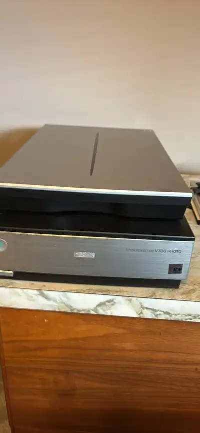 Epson V 700 scanner in near new condition. Used to scan family slide photos. Comes in original box w...