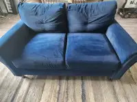 Blue velvet loveseat and armchair