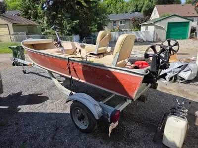 12' aluminum Gamefisher (Sears brand) deep hull fishing boat on trailer. Includes 2 removable swivel...