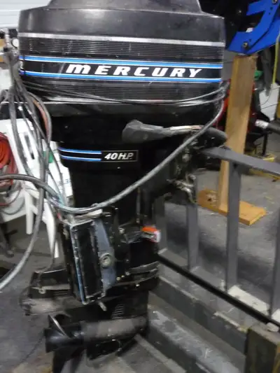 1973 Mercury 40 horsepower with controls and 2 metal gas tanks. I started working on this motor last...