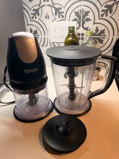 This Ninja food processor set is in good condition, featuring a powerful motor base, a smaller chopp...
