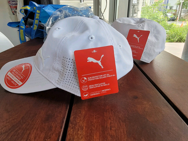New, never worn PUMA ultra white ball caps (2 @ $5 each) in Other in City of Halifax