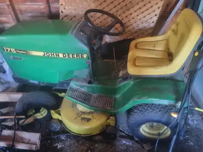 John Deere tractor with lawnmower and snowblower attachments, View more
