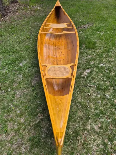 16' Prospector handcrafted canoe. New never been used. Comes with wall hangers.