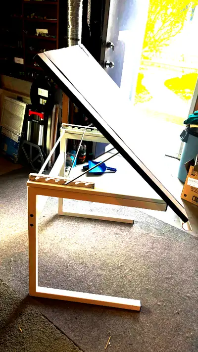 adjustable table 42" wide, 32" deep, 31" tall - when table angled to the top notch it stands 52" fai...