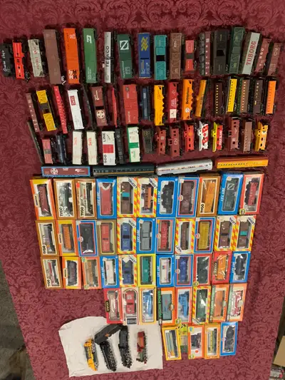 98 cars (41 in boxes) 8 engines Tech II controller Turntable with motor Track and misc accessories B...