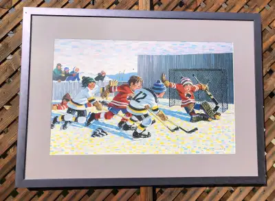 Celebrate the spirit of Canadian winters with this vibrant framed print by renowned hockey artist Bi...