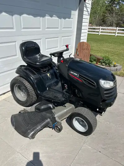 Craftsman 54 inch cut lawn tractor with a 26 hp Kohler V twin engine approximately 412 hours. Good c...