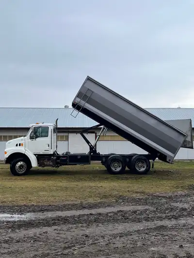 1999 Sterling Grain truck with silage Tailgate. 20ft ABC box installed in 2016. Truck stored indoors...
