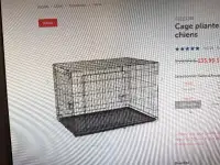 Cage pour chien en métal.