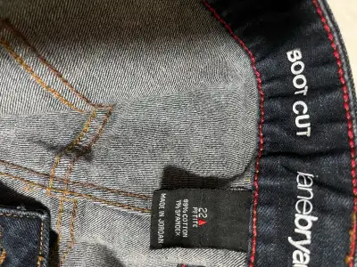 These are a pair of Lane Bryant boot cut jeans, size 22 petite. They are gently used and in good con...