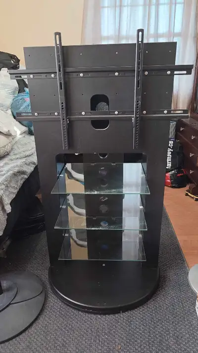 TV stand for big screen TVs up to 60 inches. With swiveling base. Very good condition