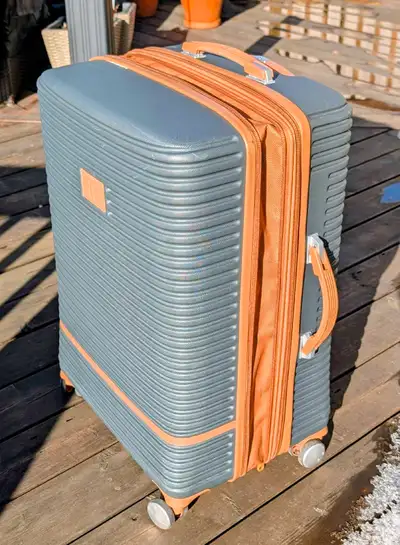 28" suitcase Grey/brown Expandable, smooth rolling Only used once Have purchase info for warranty