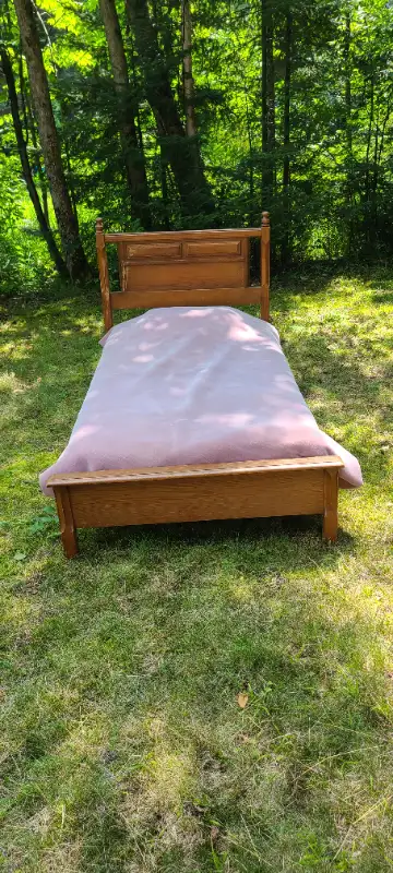 Wood frame bed.