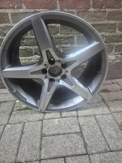 This is an authentic, used AMG rim, known for its performance and style. It has some signs of wear,...