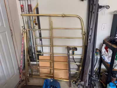 This eye-catching, vintage-style brass-tone metal bed frame is a sturdy and stylish addition to any...