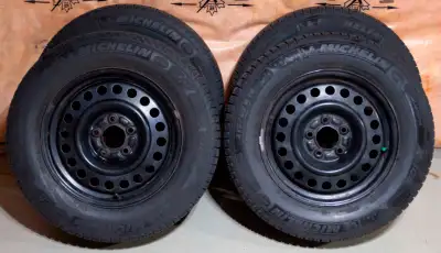 Set of very lightly used snow tires with black steel wheels (x4) The snow tires were purchased new....