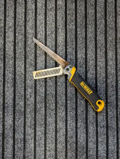 Dewalt drywall saw for sale for $10. It is sharp, it folds, it also has a built in rasp for drywall....