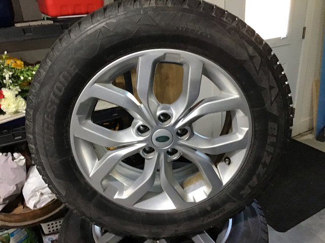 Land Rover rims with winter tires in Tires & Rims in Bedford