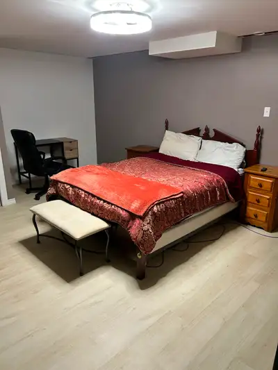 This is a large bedroom in our home with a queen size bed. You will have shared use of our home incl...