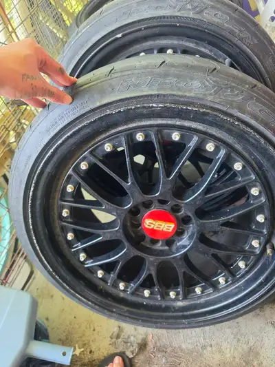 Set of four BBS wheels with tires. Tire size is 215/40ZR18 69W. Tubeless, steel-belted radial tires.