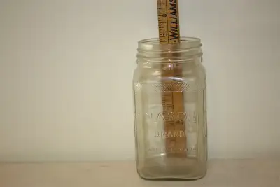 Vintage glass coffee jars and milk bottles, View more