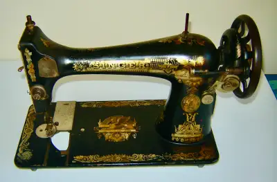 This is an antique Singer Sewing Machine model 127. This machine (serial number G4392870) was produc...