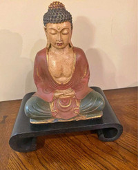 Ancient Buddha Statue with wooden stand. 7”x 10”