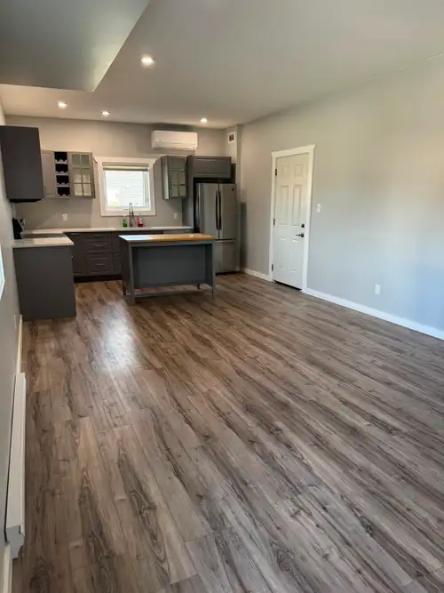 Looking for extra space and the convenience of your own garage? This bright 1,000 sq. ft. legal suit...