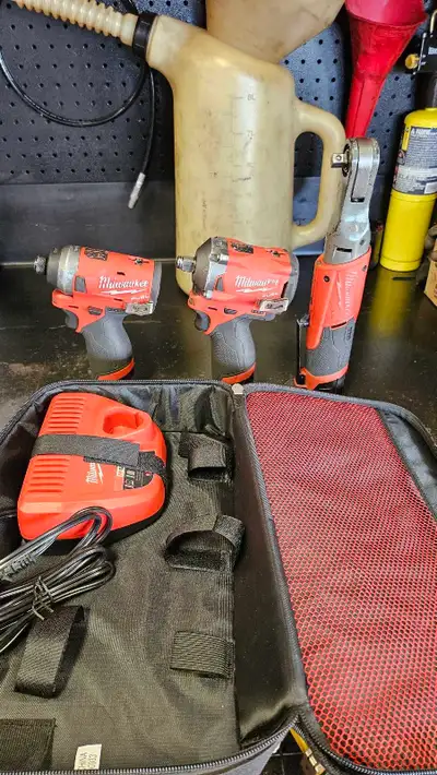 Milwaukee Impact, Ratchet & Driver with Batteries and Charger in good working condition. Impact 1/2"...