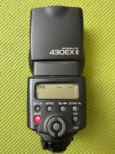 Canon Speedlite 430EX II external flash unit. It's in good working condition. Great for improving yo...