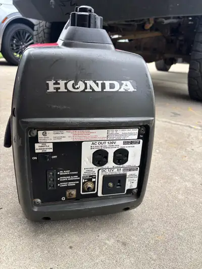 I'm selling a used Honda EU2000i generator, perfect for camping or emergencies, with a 2000-watt out...