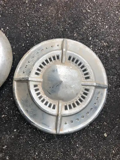 3 DOG DISH HUPCAPS, TWO CHEVROLET, ONE PONTIAC. NOT PERFECT , DRIVER QUALITY, TAKE ALL FOR $40, BELL...