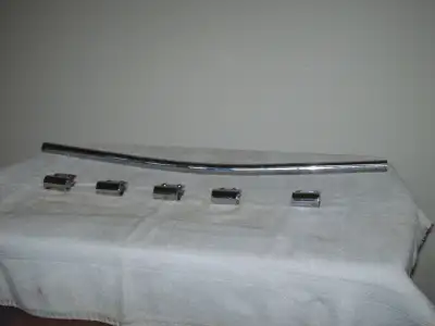 Twenty-four inch long - two & one- half inch diameter curved chrome badge bar fabricated from solid...