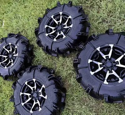 Like new Godzilla tires 30x9-14 on rims 1000$ obo