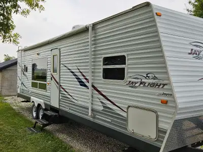 REDUCED. 31ft travel trailer, private bedroom, upgraded queen mattress, double slide out for extra k...