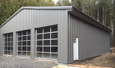 80ft x 20ft metal work shop kit produced custom by Olympia Steel. The building walls are 10ft tall,...