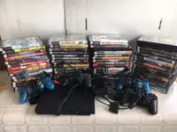 Playstation 2,  includes 60 games and assorted accessories