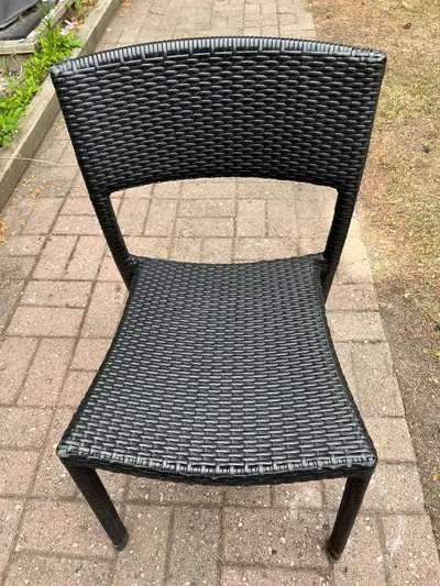 12 available - $50 each. 10 with arms, 2 without arms Synthetic wicker patio dinner dinning side com...