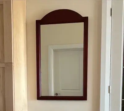 PRICE REDUCTION: Hallway Mirror in a mahogany colour frame is in excellent condition. It looks well...
