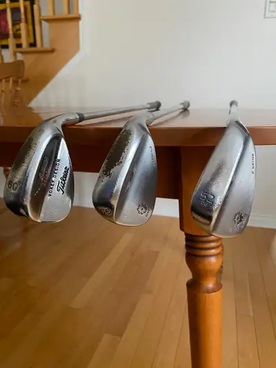 They are 1" longer than standard. Midsize align grips in good condition. The 52 degree is 08 F grind...